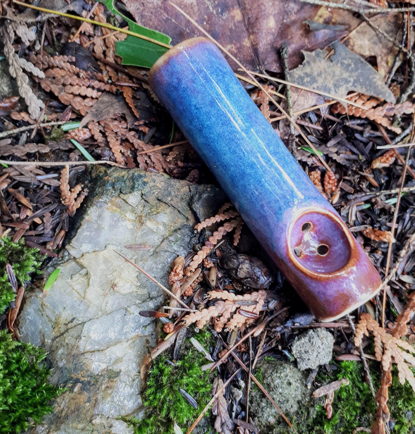 Blue rain, purple and blue mini purse pipe on quartz and leaves
